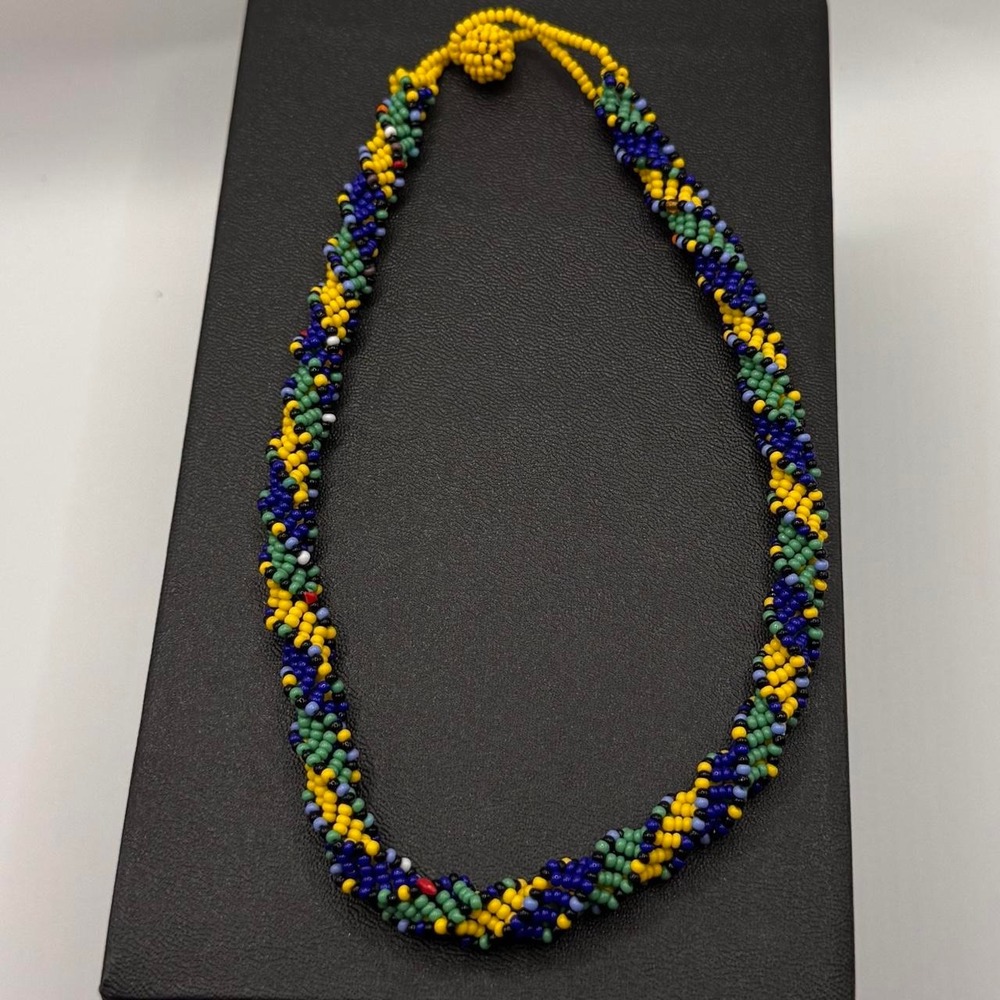 Handmade beaded necklace with blue, yellow, and green beads